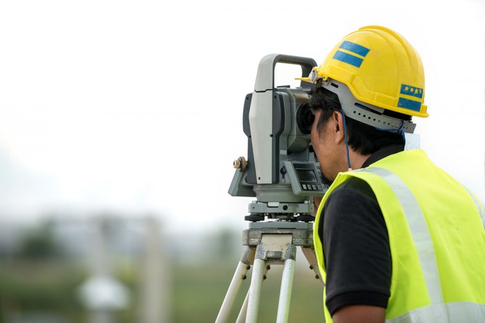 Man using a total station
